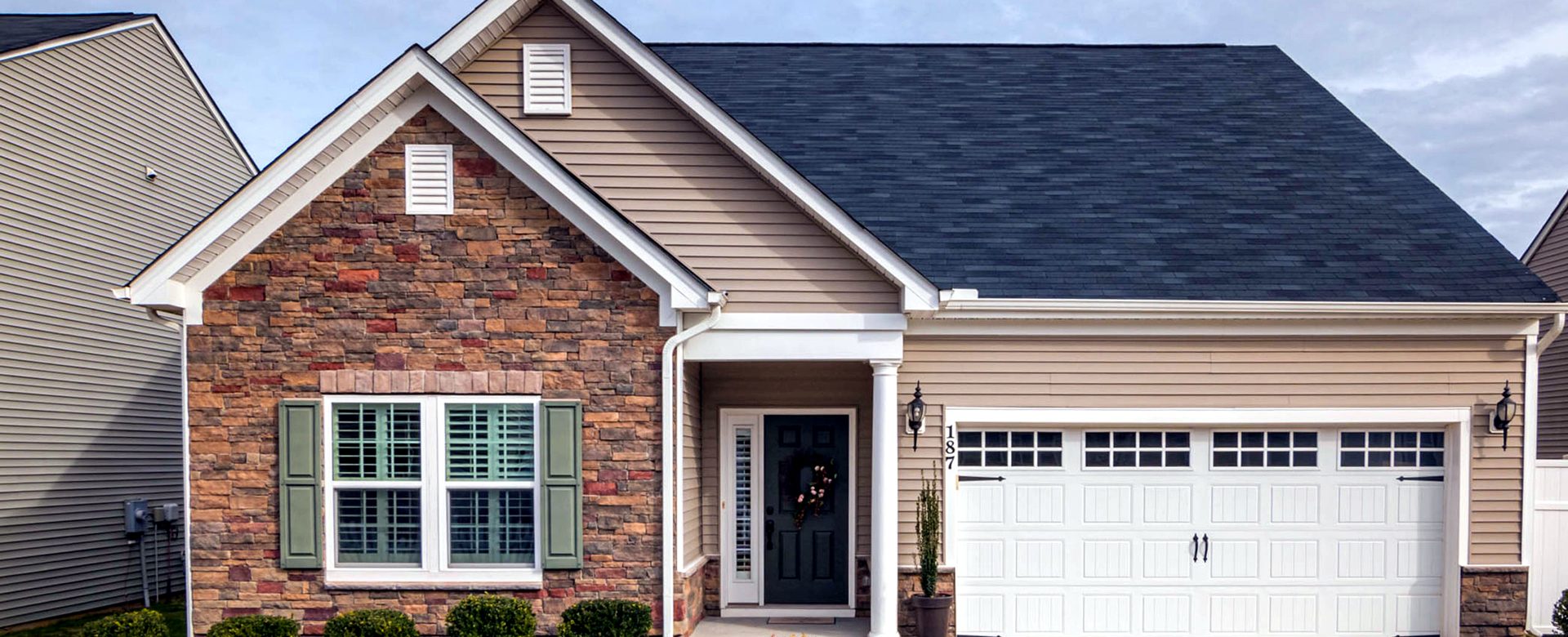 A brick home with a two-car garage