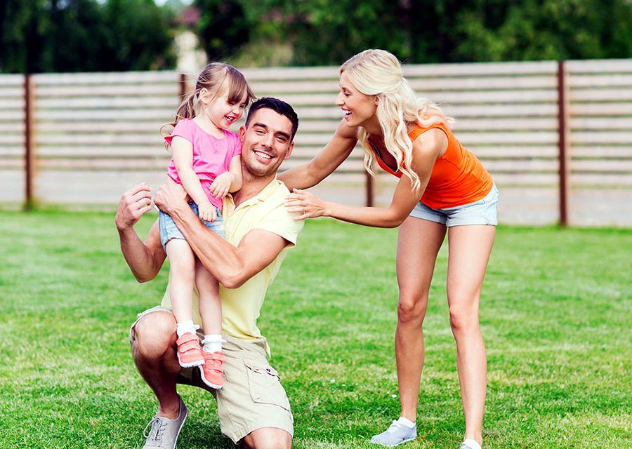 A family playing in their backyard